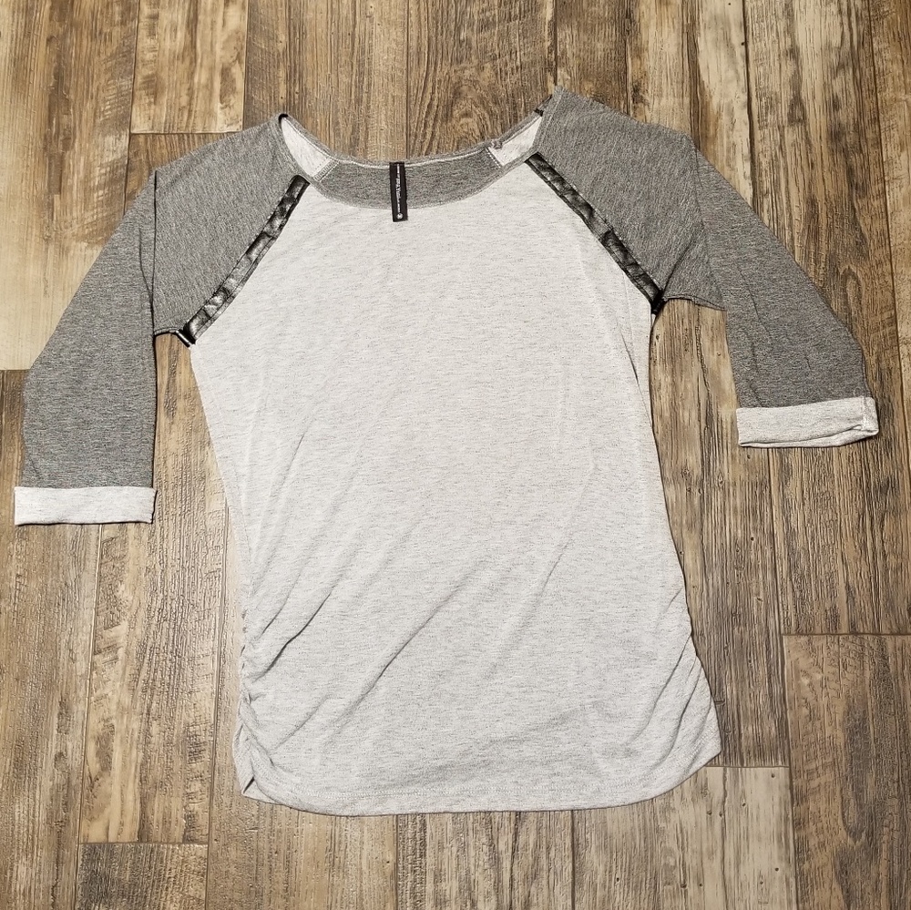 Gray Top with black faux leather detail at shoulders